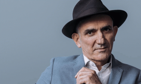 Paul kelly in a hat