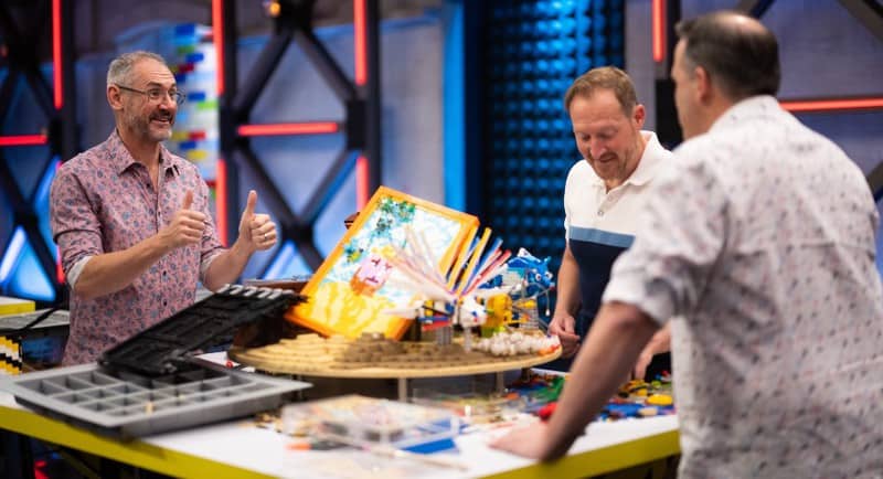 Lego Masters judge Brickman with contestants Trent and Paul