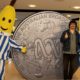 Tony Armstrong with Bananas in Pyjamas alongside ABC commemorative coin