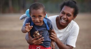 News Corp Australia - Closing the Gap Lisa Tabulai with her son John Tabulai during an afternoon walk in Mapoon Picture David Caird (1)