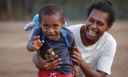 News Corp Australia - Closing the Gap Lisa Tabulai with her son John Tabulai during an afternoon walk in Mapoon Picture David Caird (1)