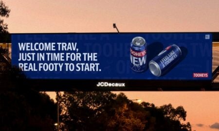 Tooheys out of home billboard by Thinkerbell inviting Travis Kelce to real footys as he touches down in Sydney for Taylor Swift concert