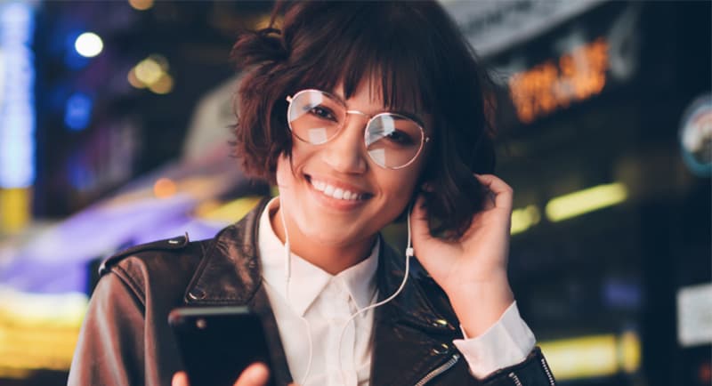 woman listening to audio stock cra