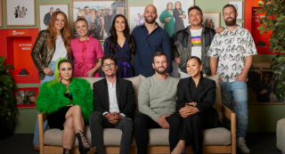 the block cast standing and sitting together