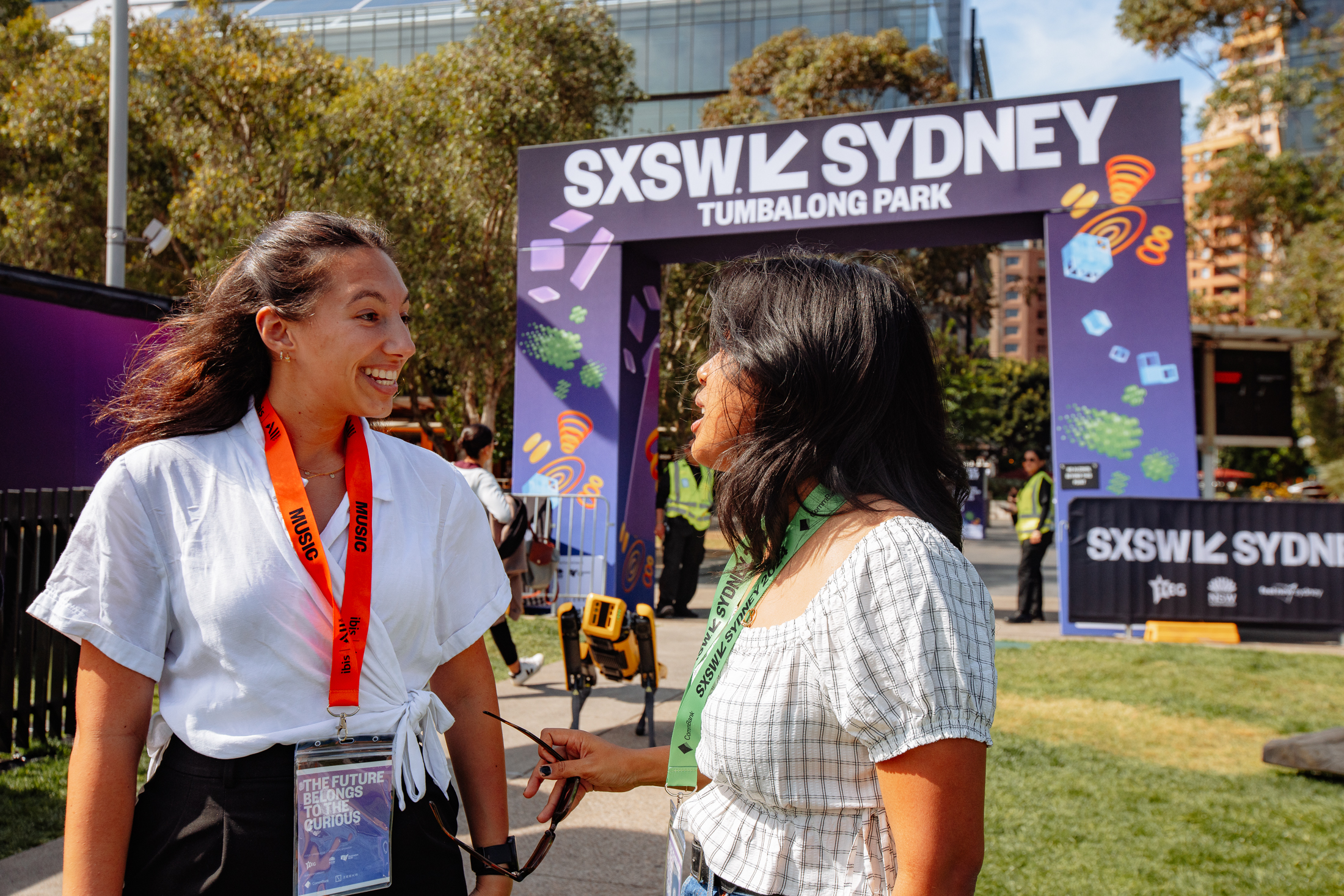 Two women stand outside SXSW Sydney Tumablong park