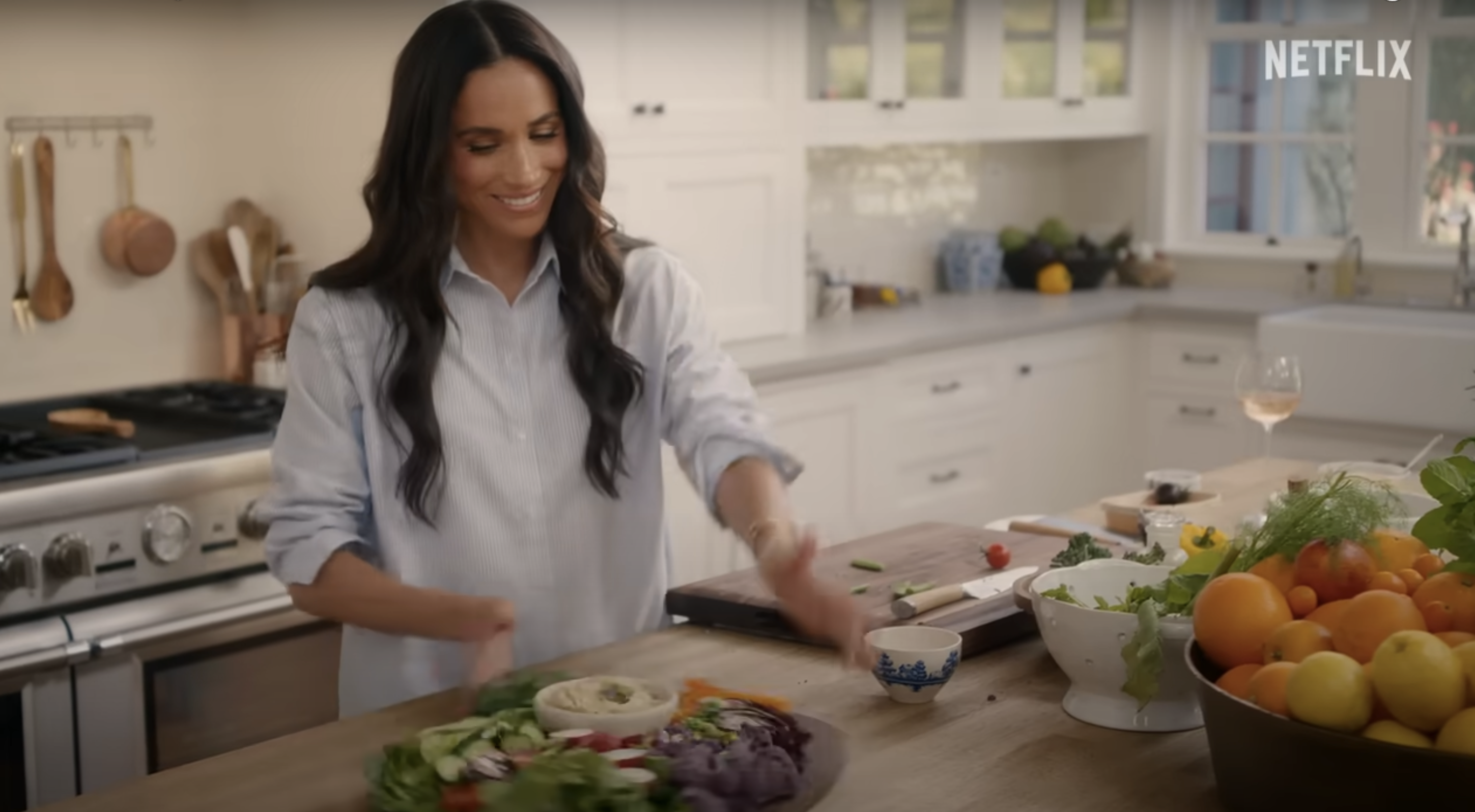 Meghan Markle in a kitchen cooking