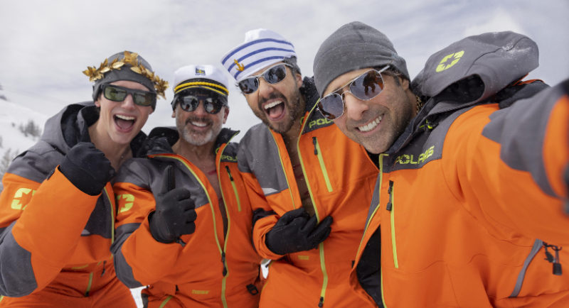 Actors from Mountainhead in the snow smiling