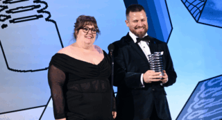 Toni Lodge and Ryan Jon Dunn speak onstage during the 29th Annual Webby Awards.