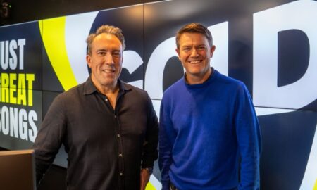 Alex Cullen stands beside Christian O'Connell