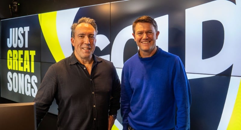 Alex Cullen stands beside Christian O'Connell