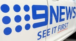 Nine News logo on car door