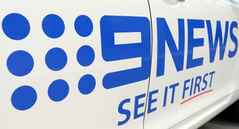 Nine News logo on car door