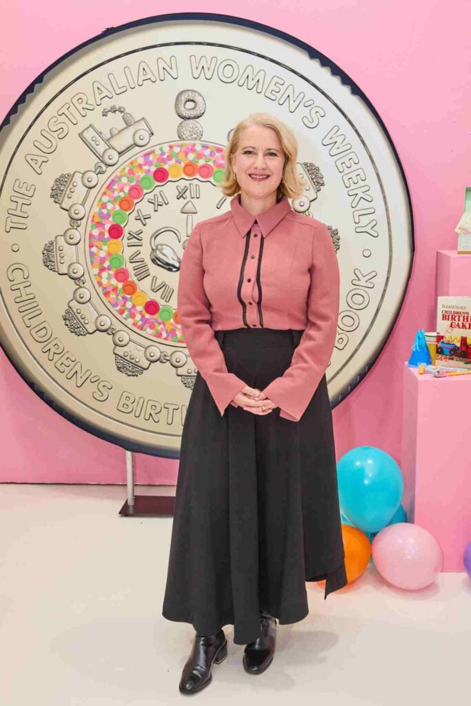 Sophie Tedmanson stands in front of a coin replica.