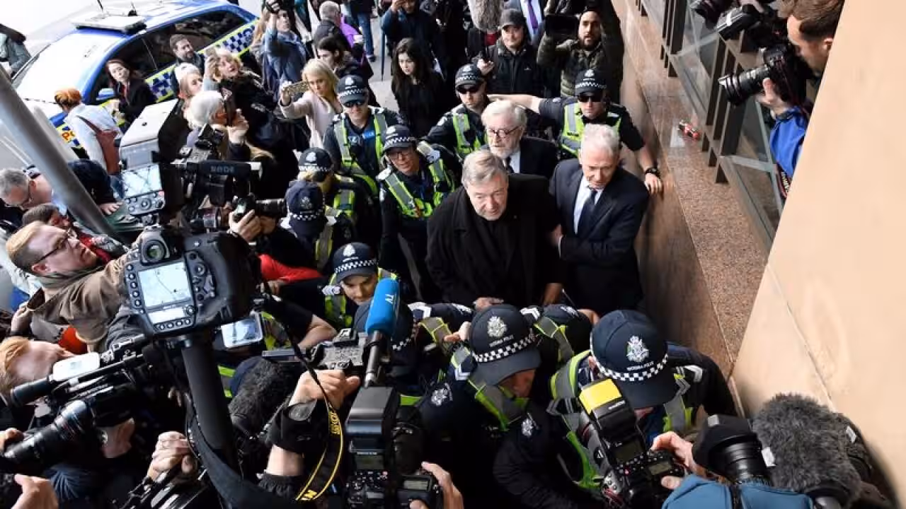 Cardinal George Pell and the media swarm during his trial