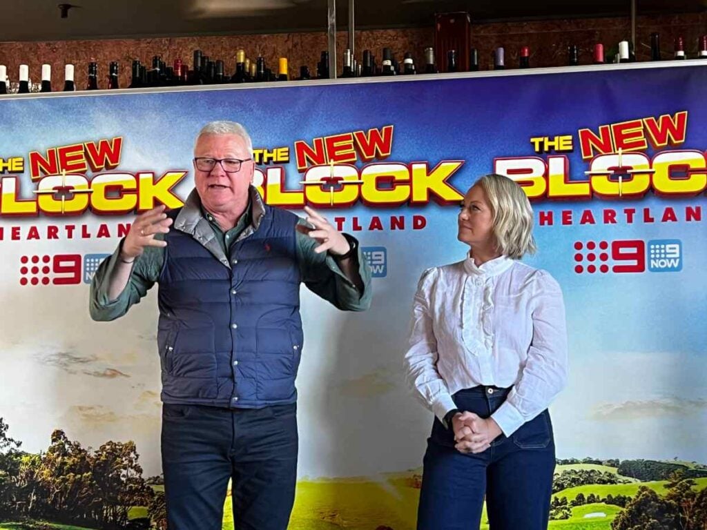 Scott Cam and Shelley Craft stand in front of The Block signage