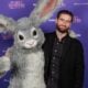 Tubi exec David Salmon stands alongside Tubi's rabbit mascot