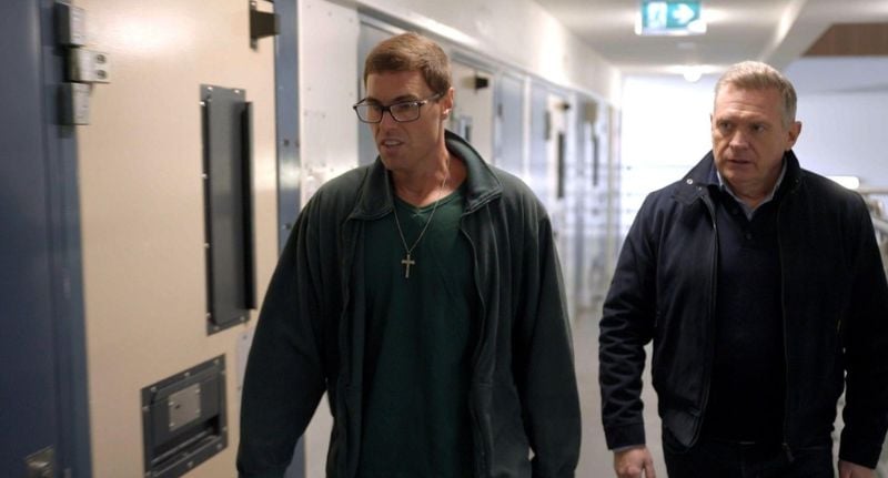 Michael Usher stands with Samual Davidson in jail.