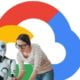 Woman works alongside bot in front of Google Cloud logo