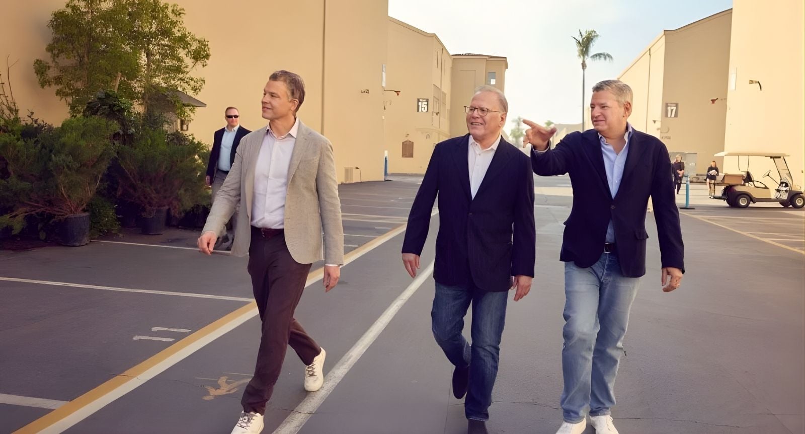 Zaslav strolling the famed studio lot with Ted Sarandos and Greg Peters, who are co-CEOs
