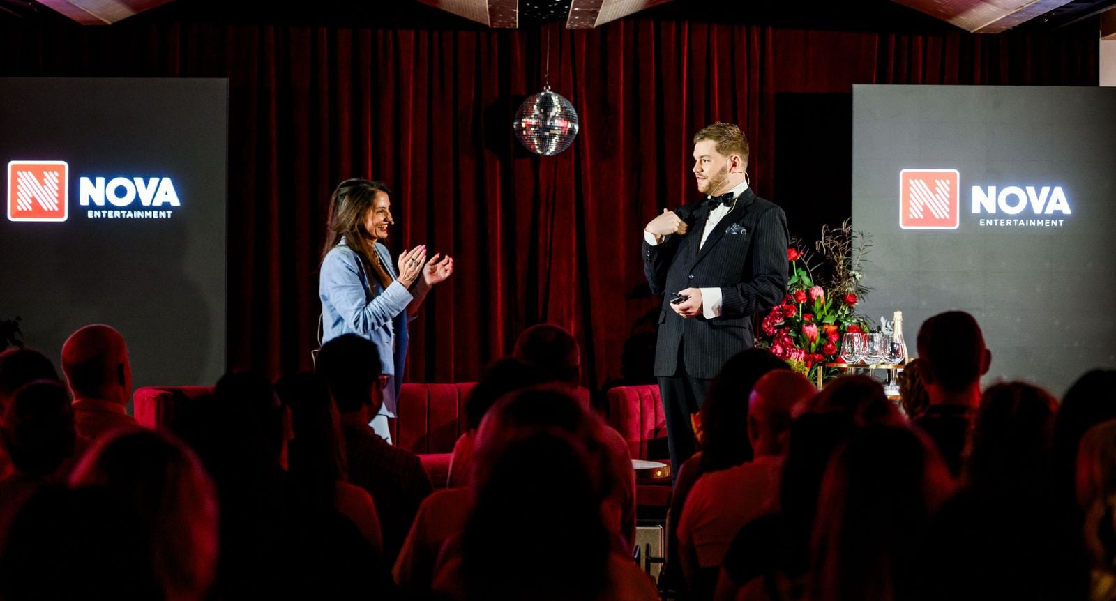 Nicole Bence on stage at Nova's Infronts with Joel Creasy.