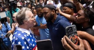 Supporters of Austin Metcalf and Karmelo Anthony clash outside court. Source: Getty