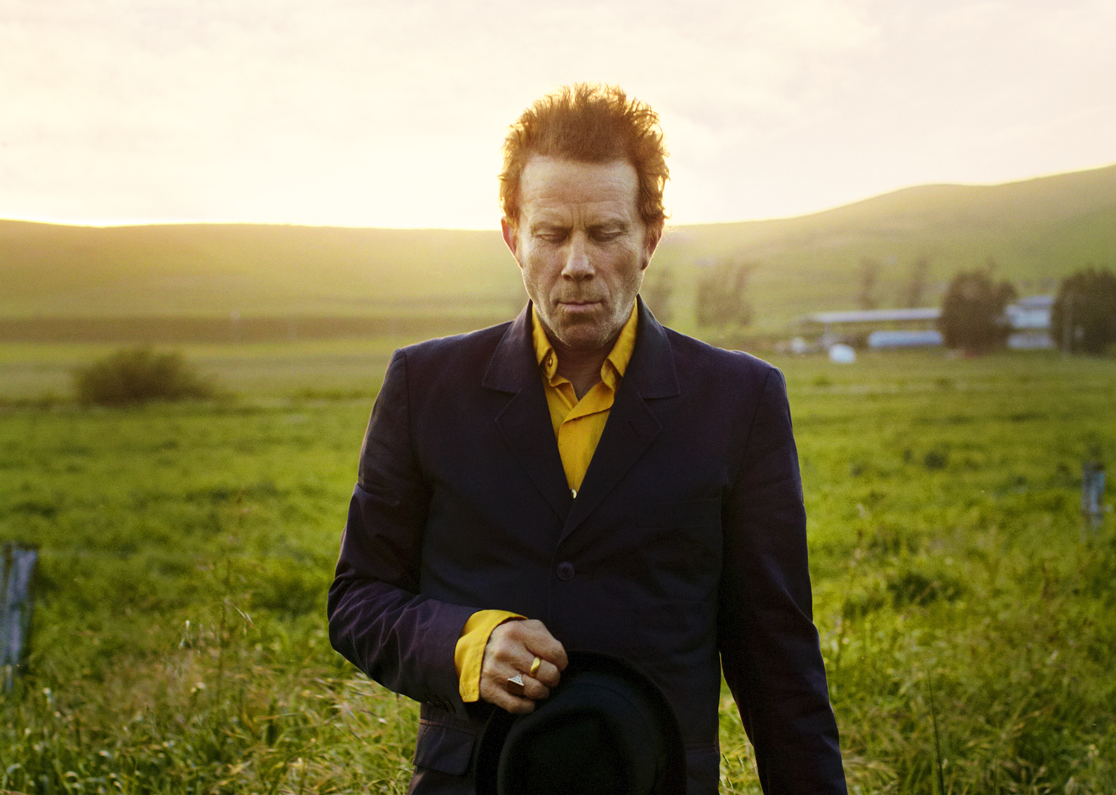 tom waits in green field
