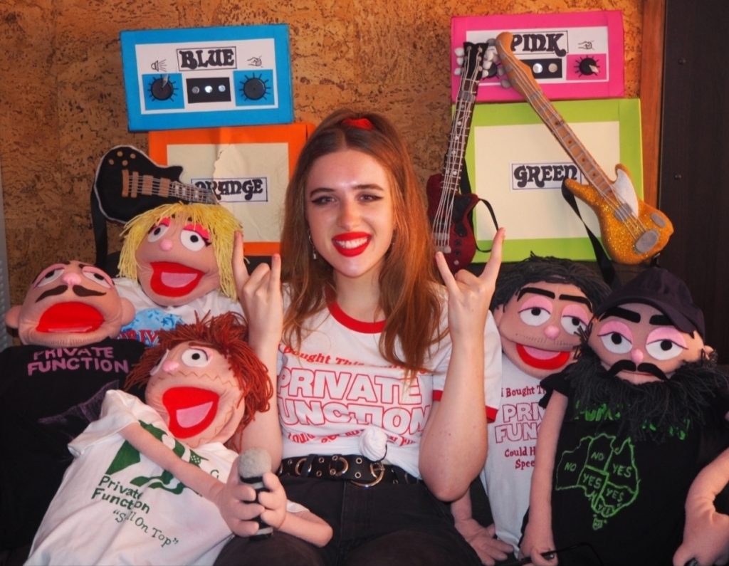 Lauren Hester with puppets made in the likes of the members of Private Function
