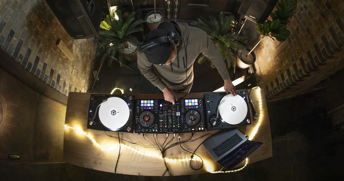 Amateur DJ playing on a Pioneer DDJ-800 controller