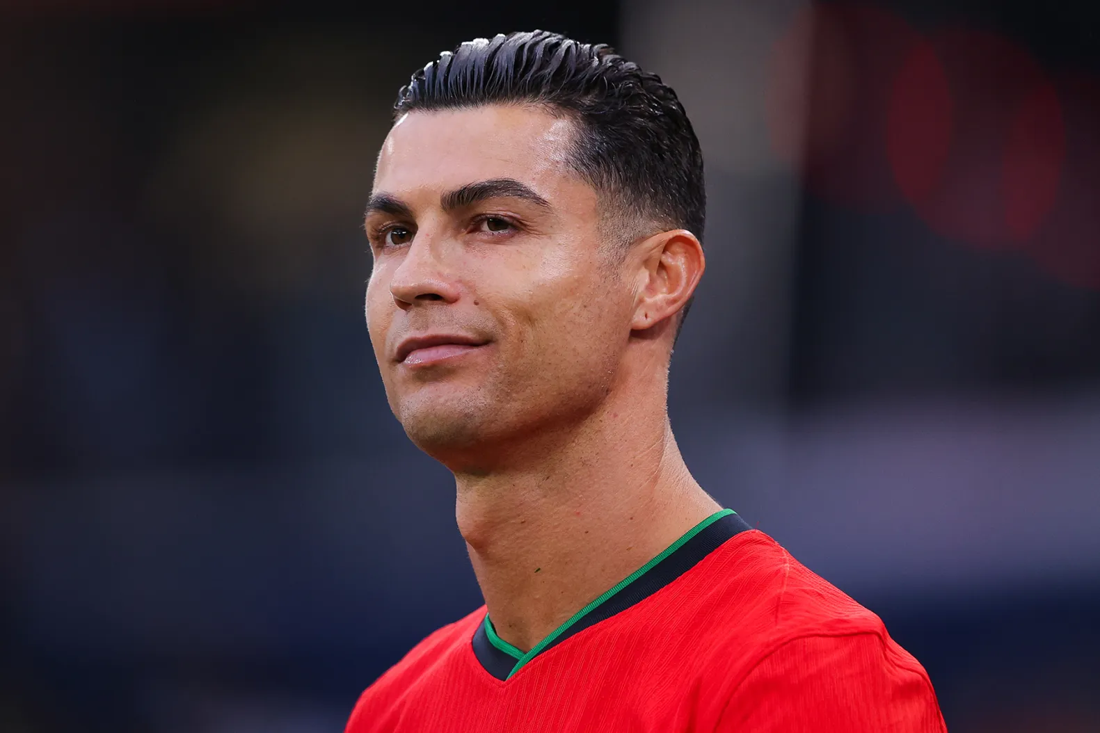 Cristiano Ronaldo of Portugal looks on prior to the UEFA EURO 2024 quarter-final match between Portugal and France at Volksparkstadion on July 05, 2024 in Hamburg, Germany. James Gill - Danehouse/Getty Images