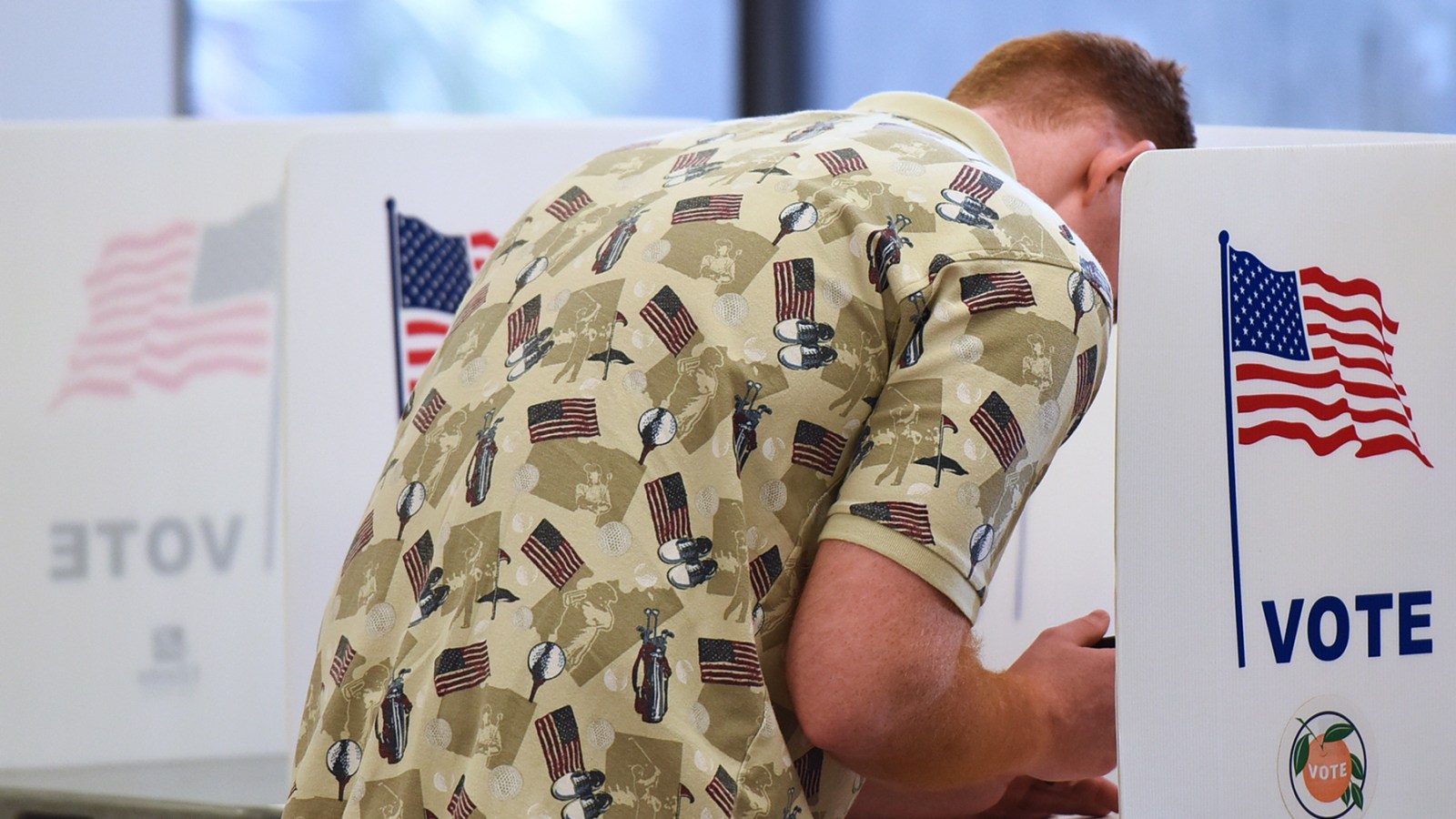 A voter fills out his ballot in Florida