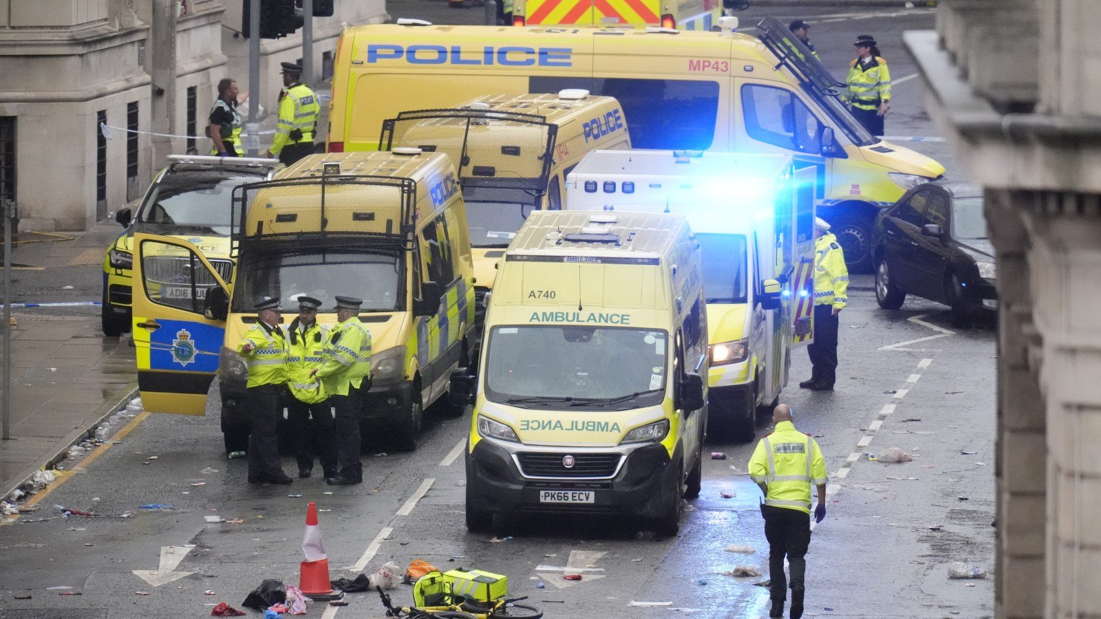 Police and emergency personnel on Water Street in Liverpool after a car collided with pedestrians during the Premier League winners' parade