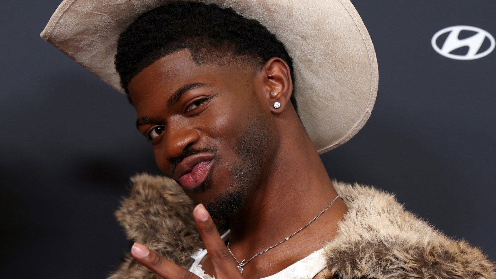 Lil Nas X poses at event