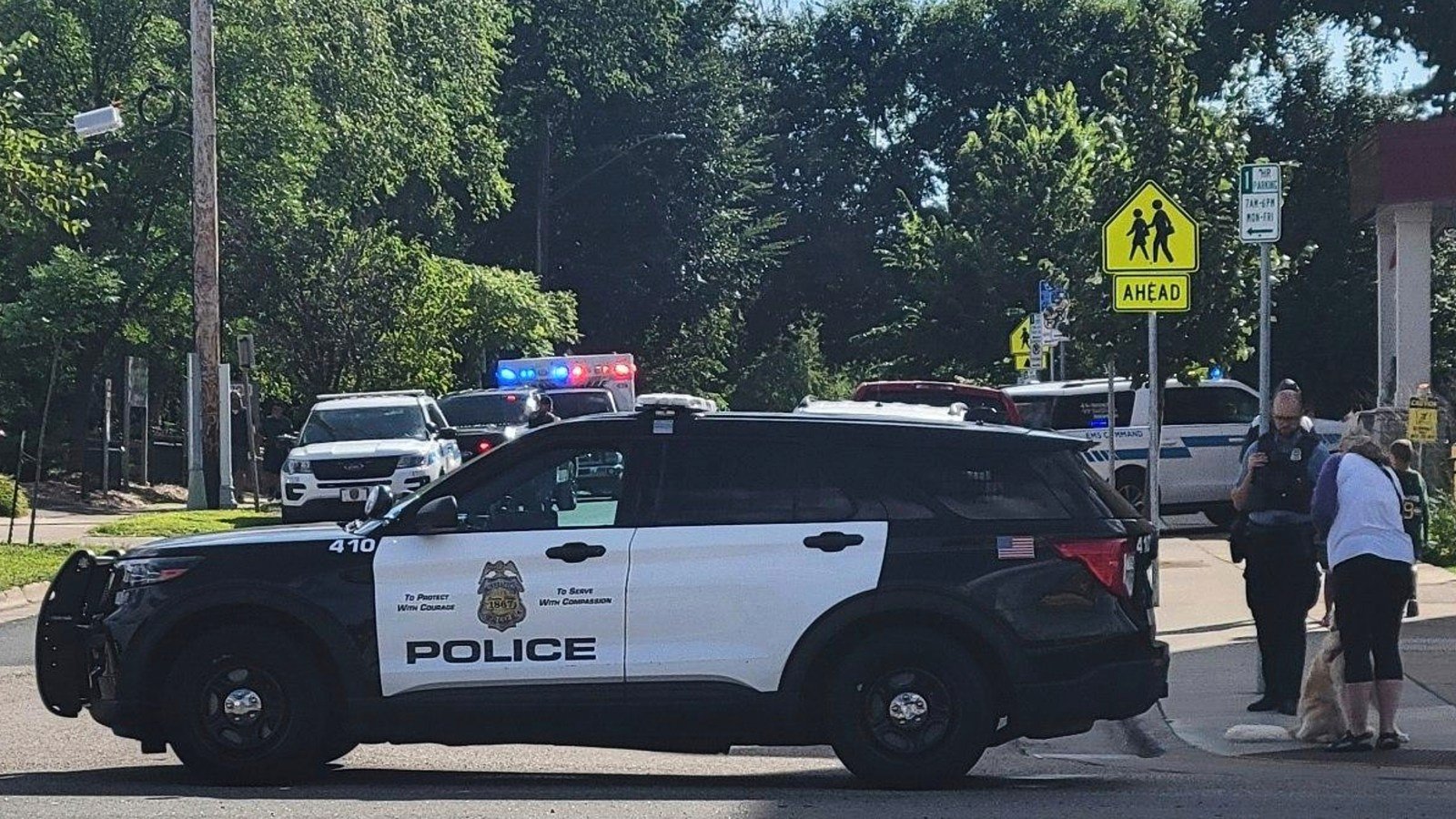 Police offers outside of the Annunciation Church’s school after a mass shooting