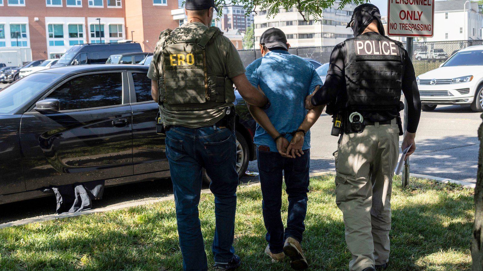 ICE agents detain an immigrant