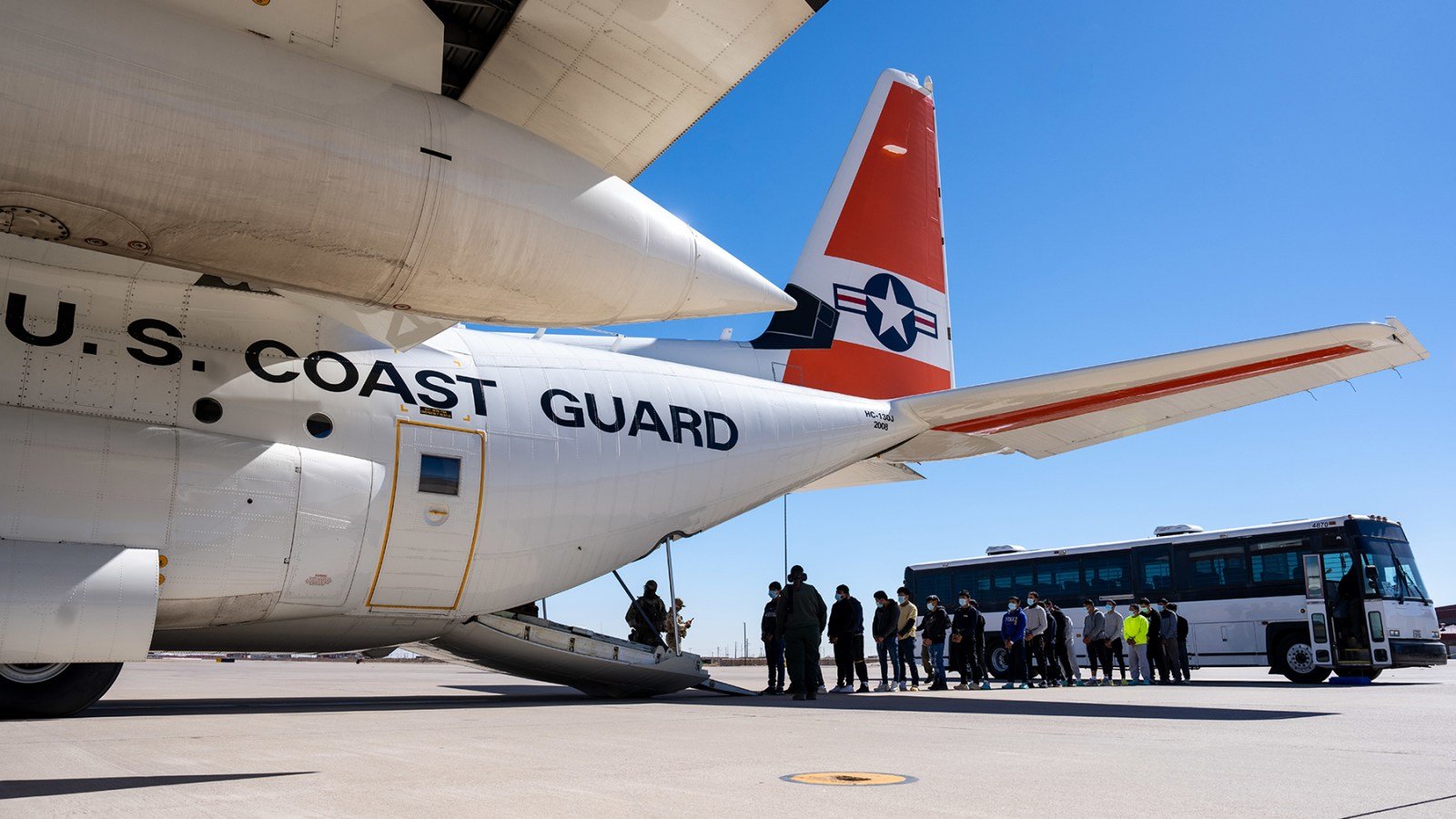 US Coast Guard C-130 Hercules crew prepares for an immigrant expulsion flight in El Paso, California