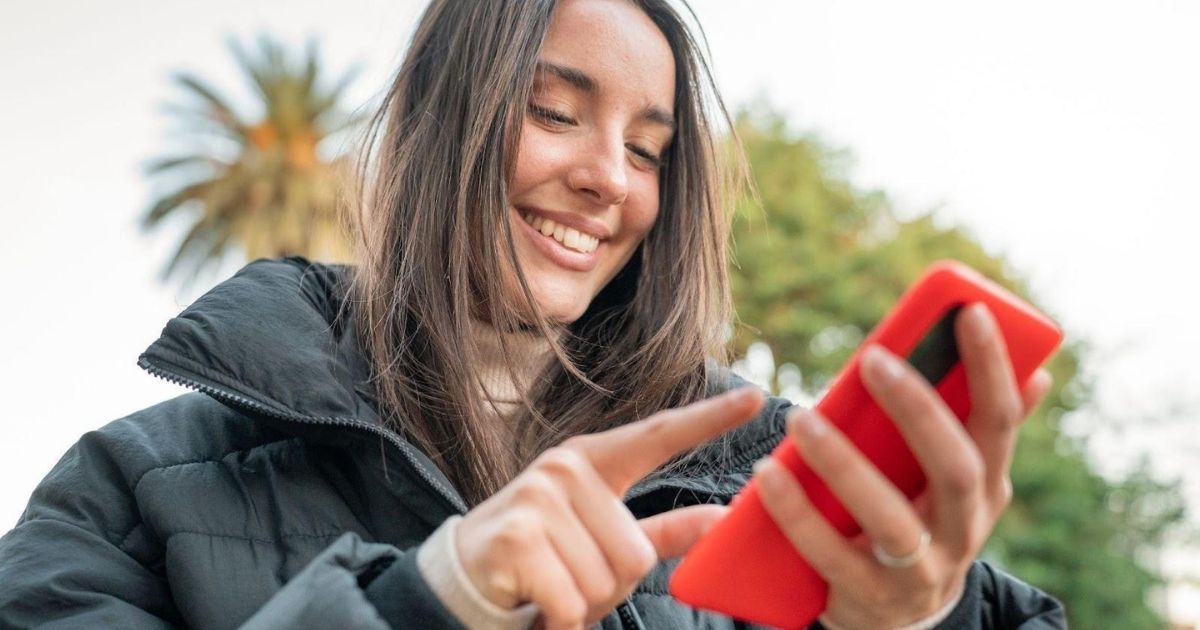 Woman scrolls on phone