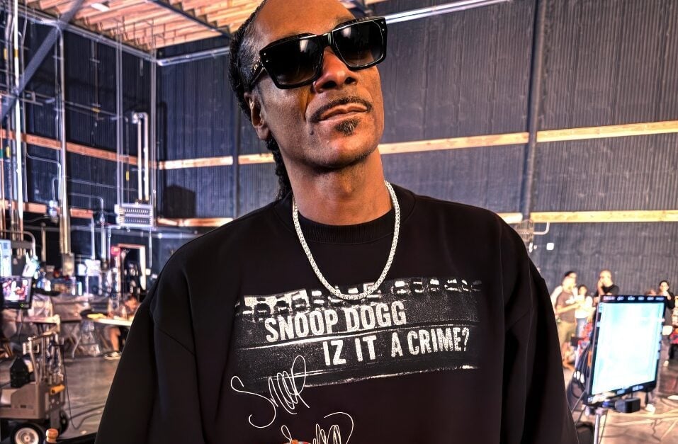 Snoop Dogg holding AFL football
