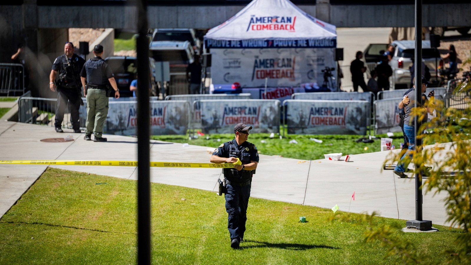 Law enforcement tapes off an area after Charlie Kirk was shot at Utah Valley University