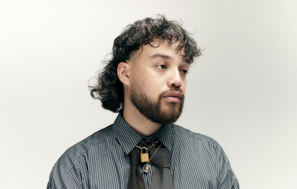 a headshot of BOY SODA staring off camera