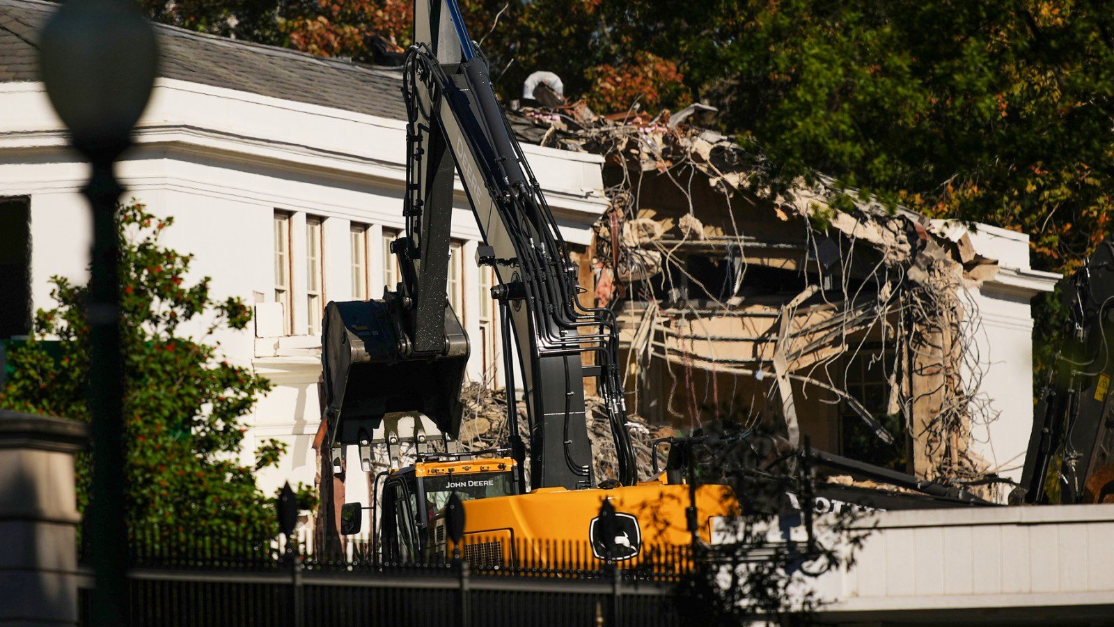 The facade of the East Wing of the White House is demolished by work crews