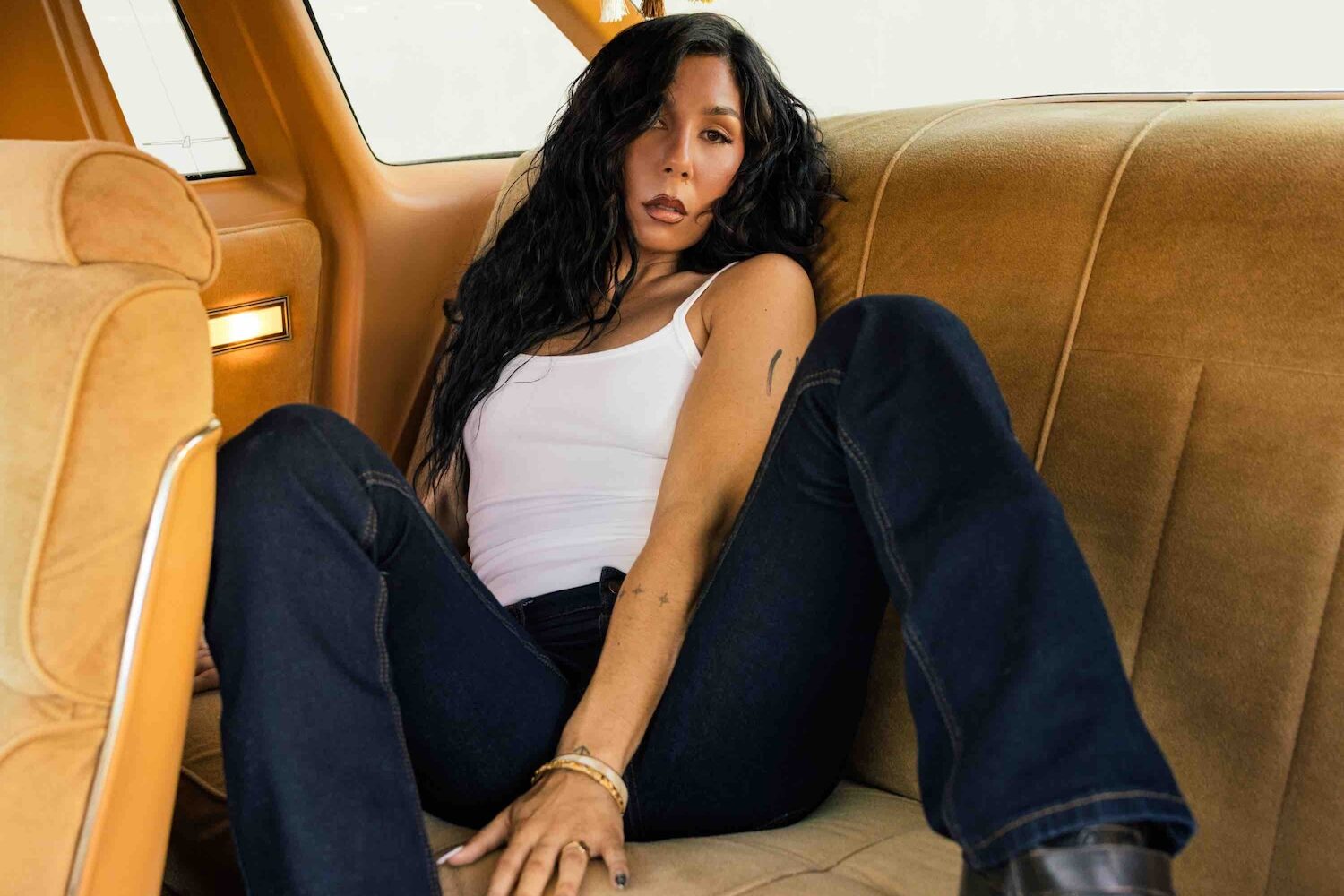 Miss Kaninna sitting in the backseat of a car