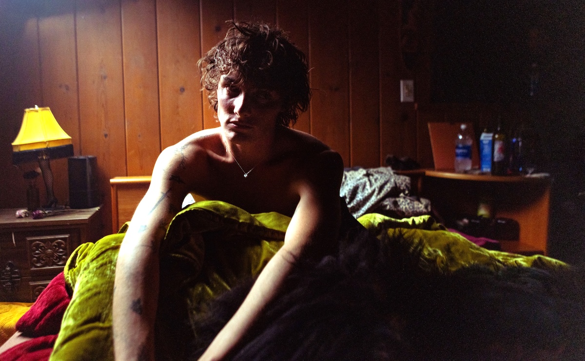 Thomas Day sitting in a bed