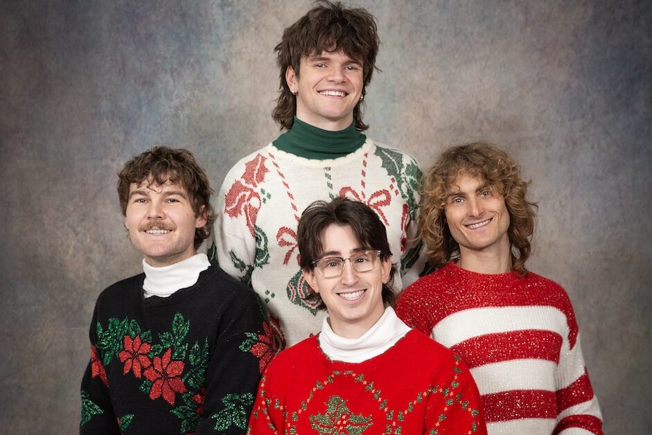 Teenage Dads posing in Christmas sweaters
