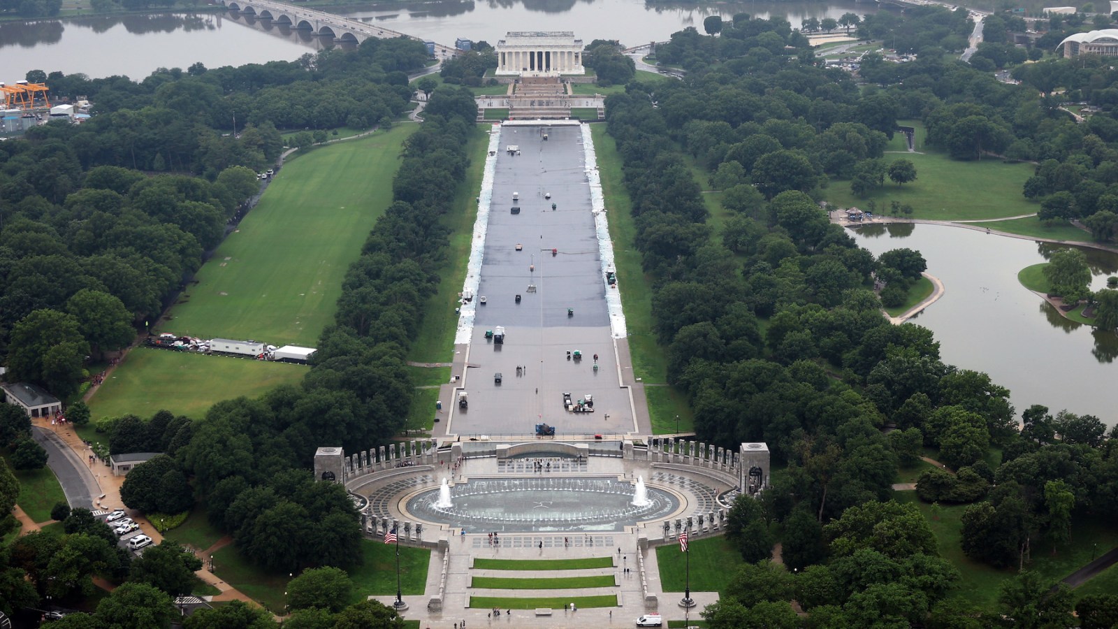 Workers continue to paint the bottom of the Lincoln Memorial Reflecting Pool on the National Mall in Washington, DC