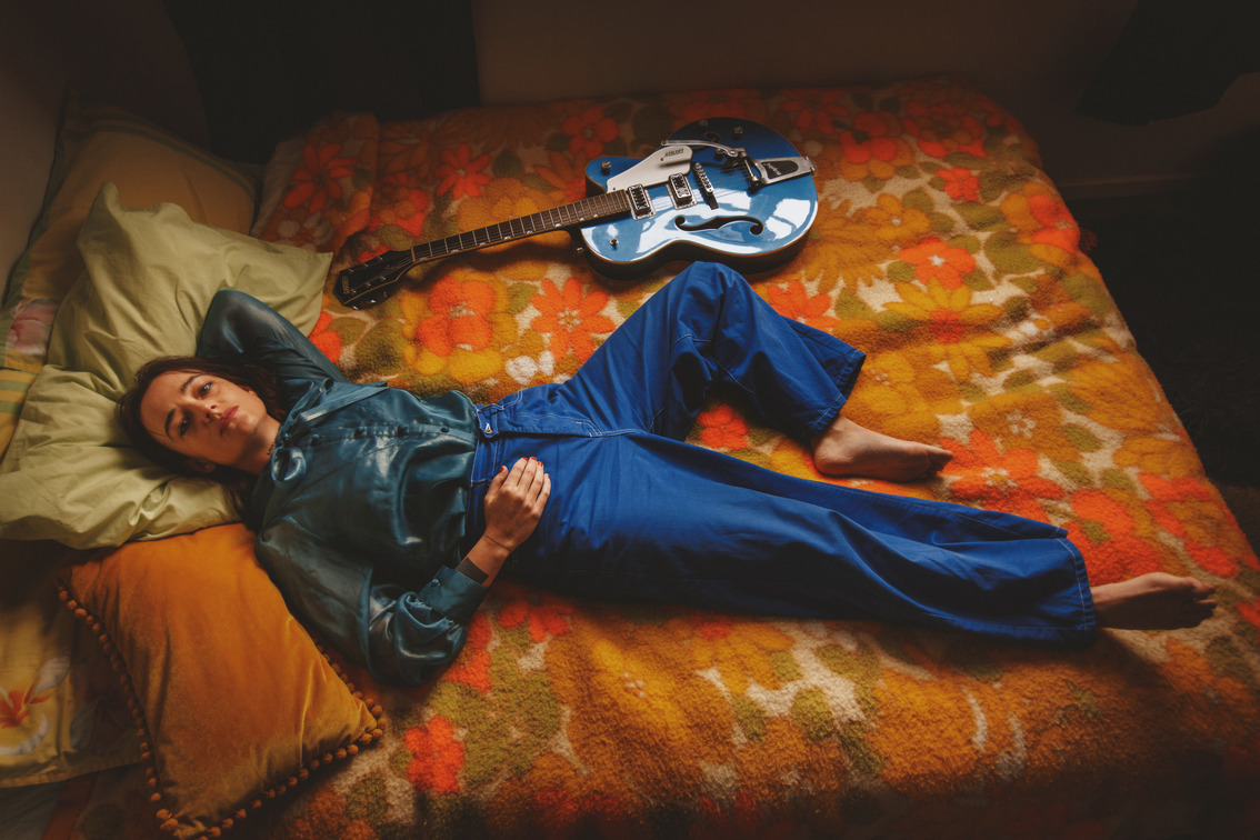 Jazmine Mary on a bed