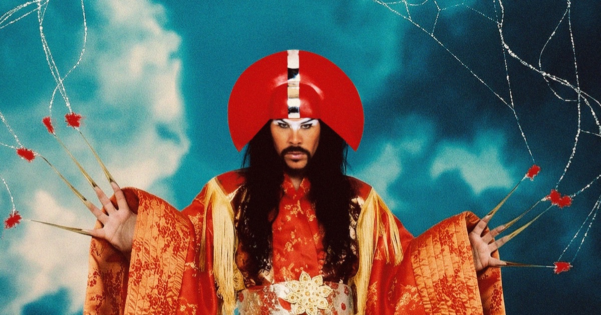Empire of the Sun promotional image featuring a performer in a red headdress and gold robe against a blue background.