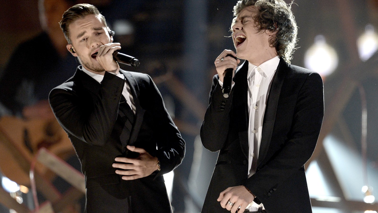 Singers Liam Payne (L) and Harry Styles of One Direction perform onstage during the 2013 American Music Awards at Nokia Theatre L.A. Live on November 24, 2013 in Los Angeles, California.