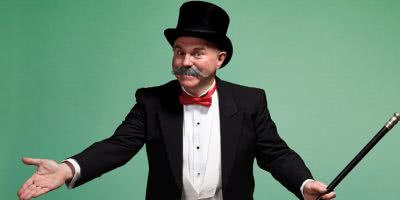 Moustached gentleman in a top hat, suit and red bowtie, carrying a cane on a mint green background