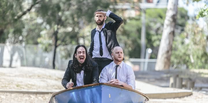 Three comedians from Aunty Donna on a park playground sailing ship