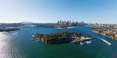Sydney Harbour, Sydney Harbour Bridge and Sydney's city skyline, with Goat Island in the foreground